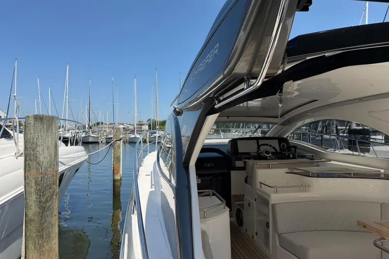Slide: The Image of Schaefer 400 yacht docked at marina, showcasing sleek design and luxurious interior, 2023 model. - 37