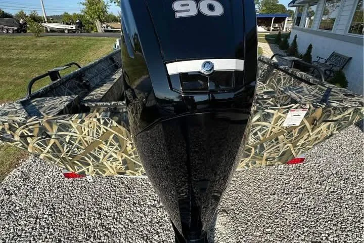 Slide: The Image of 2026 Smoker Craft Sportsman 1866 boat with camouflage design and powerful outboard motor. - 5