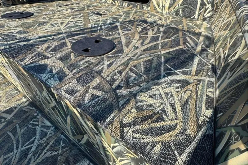 Slide: The Image of 2026 Smoker Craft Sportsman 1866 boat deck with camouflage pattern. - 8