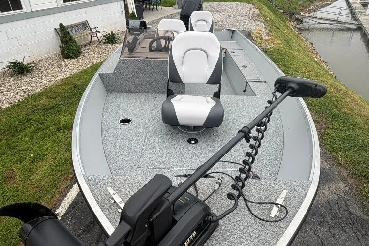 Slide: The Image of 2026 Smoker Craft Angler 16 SC fishing boat with modern seating and trolling motor. - 5