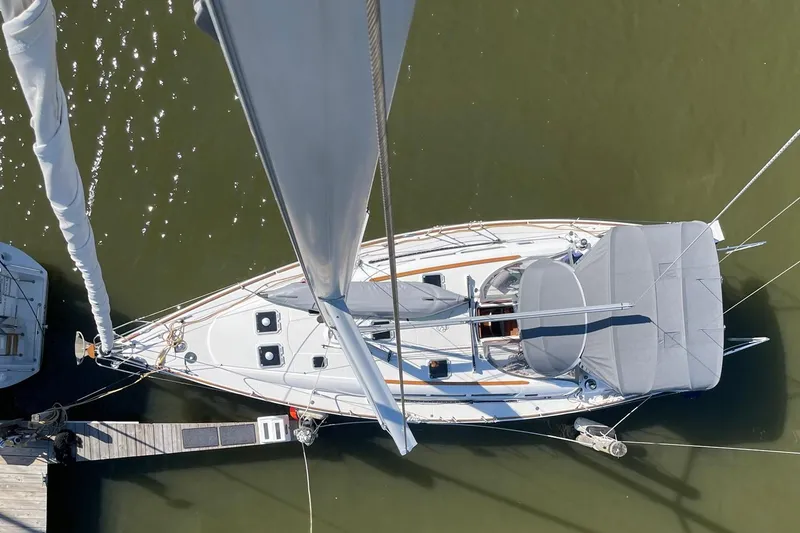 Slide: The Image of Overhead view of 2006 Jeanneau Sun Odyssey 45 sailboat docked in calm waters. - 9