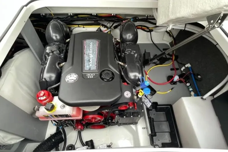 Slide: The Image of Engine compartment of 2026 Four Winns H6 boat, featuring a powerful V8 engine. - 10