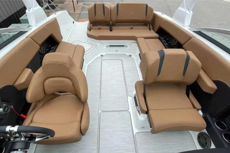Slide: The Image of Luxurious interior of 2026 Four Winns H6 boat with tan leather seating. - 5