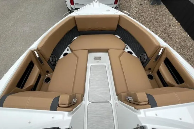 Slide: The Image of 2026 Four Winns H6 boat interior with tan seating and modern design. - 8