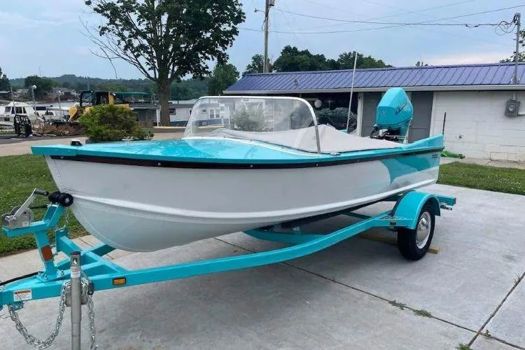 The Image of 2026 Starcraft 57 Ski Champ boat on trailer, parked outdoors. - 1