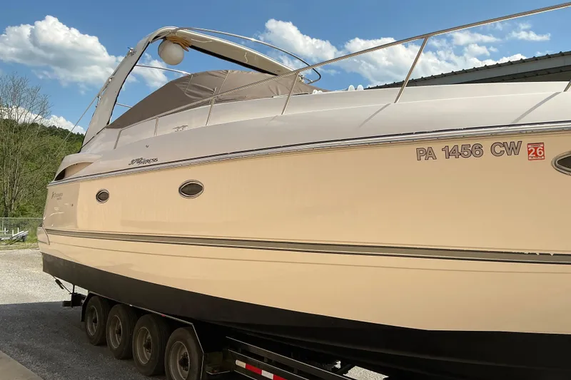 Slide: The Image of 2005 Cruisers Yachts 370 Express on trailer under clear sky. - 3