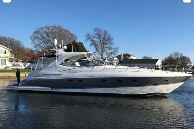 The Image of 2008 Cruisers Yachts 560 Express on calm water, showcasing sleek design and luxury features. - 0