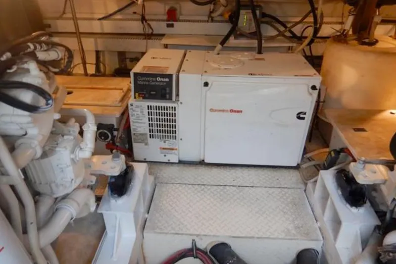 Slide: The Image of Engine room of 2008 Cruisers Yachts 560 Express with Cummins Onan marine generator. - 19