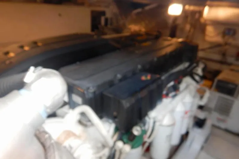 Slide: The Image of Blurry engine room of 2008 Cruisers Yachts 560 Express, showcasing mechanical components. - 20