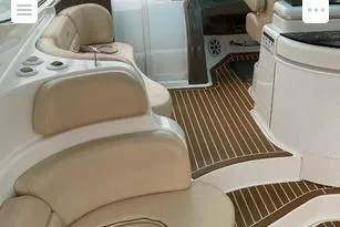Slide: The Image of Luxurious interior of 2008 Cruisers Yachts 560 Express with beige seating and wood flooring. - 6