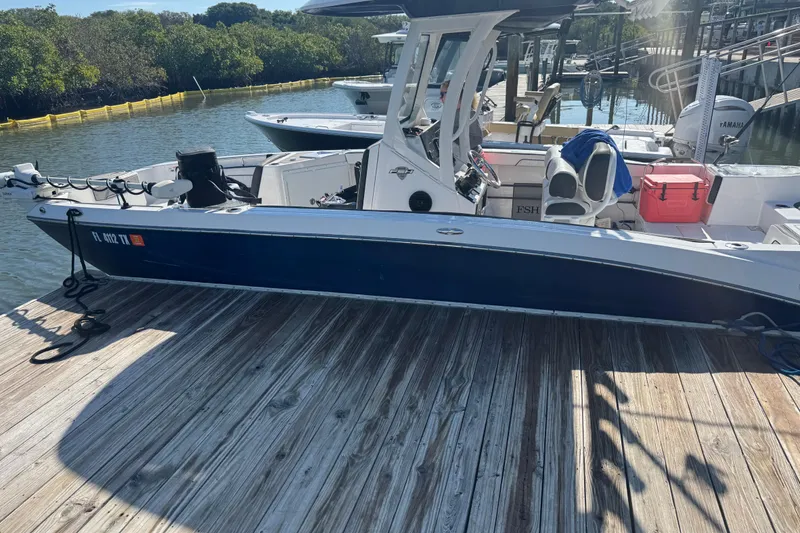 The Image of 2025 Yamaha Boats 255 FSH Sport H docked, showcasing sleek design and modern features. - 1