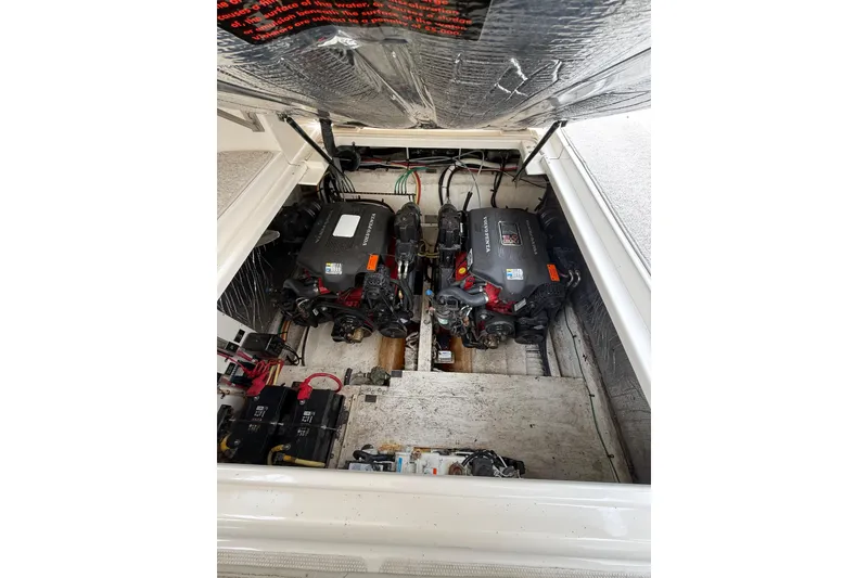 Slide: The Image of Engine compartment of 2004 Cruisers Yachts 320 Express with dual engines and wiring. - 10
