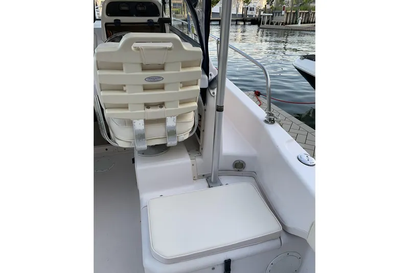 Slide: The Image of 2001 Grady-White Seafarer 226 boat interior with seating and water view. - 13