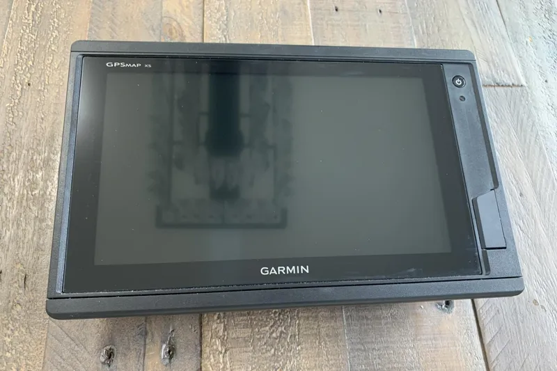 Slide: The Image of Garmin GPSMAP XS device on wooden surface, related to 2001 Grady-White Seafarer 226. - 16
