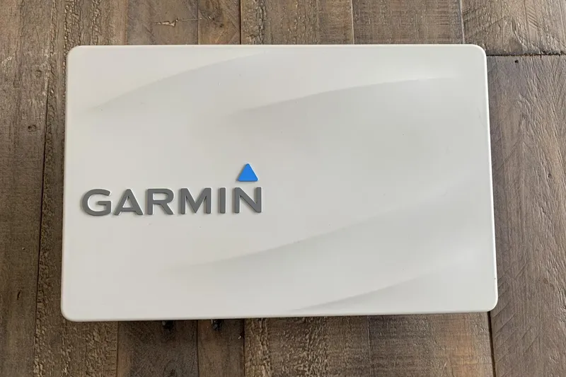 Slide: The Image of Garmin device on wooden surface, related to 2001 Grady-White Seafarer 226 boat. - 17