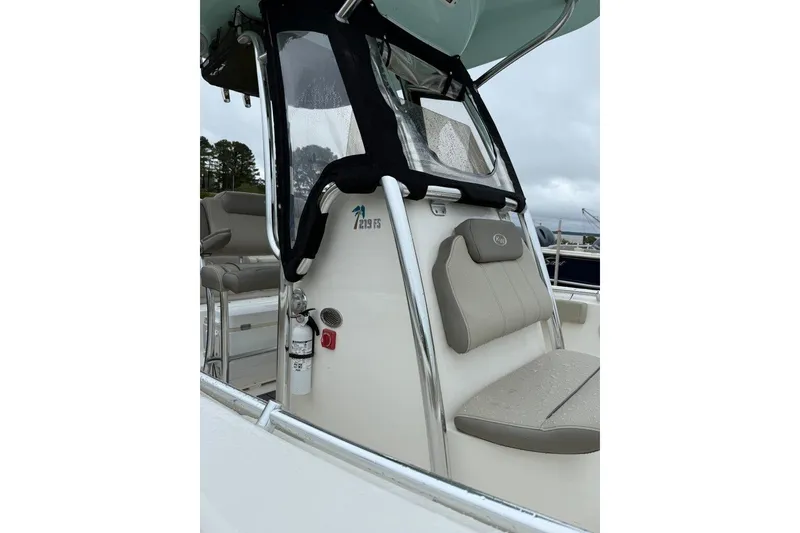 Slide: The Image of 2023 Key West 219 FS boat interior with seating and safety equipment. - 2