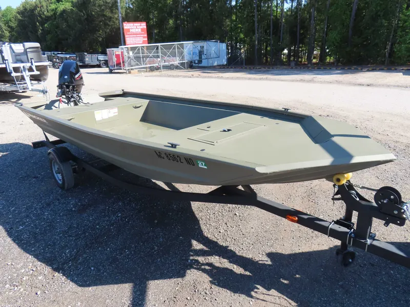 The Image of 2024 Tracker 1648 AWL aluminum boat parked on trailer outdoors. - 1