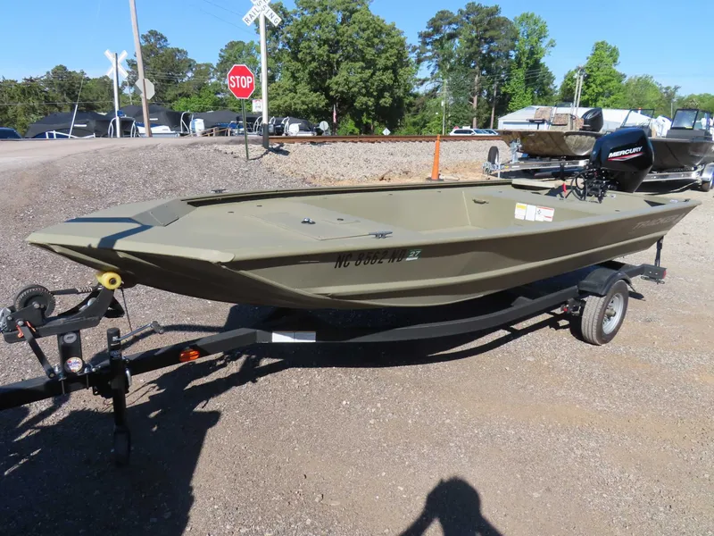 Slide: The Image of 2024 Tracker 1648 AWL boat on trailer, parked outdoors. - 10