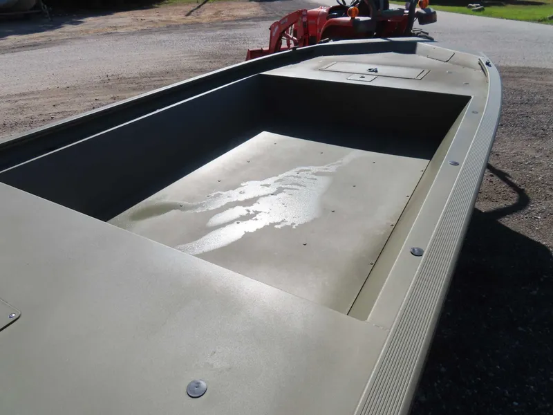 Slide: The Image of 2024 Tracker 1648 AWL aluminum boat on gravel surface. - 18