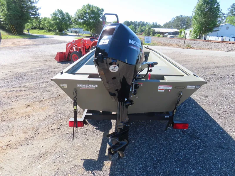 Slide: The Image of 2024 Tracker 1648 AWL boat with Mercury engine outdoors. - 7