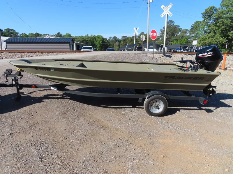 Slide: The Image of 2024 Tracker 1648 AWL boat on trailer, parked outdoors. - 9