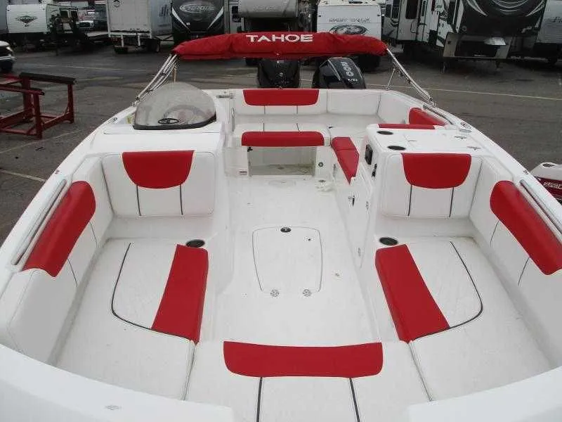 Slide: The Image of Interior view of 2025 Tahoe 2150 OB boat with red and white seating. - 3