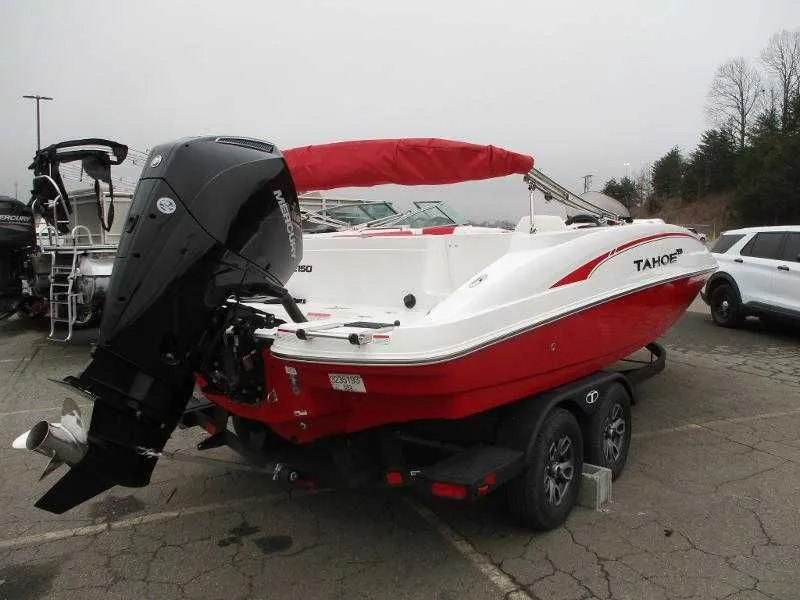 Slide: The Image of 2025 Tahoe 2150 OB boat with outboard motor on trailer. - 4