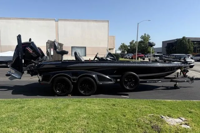 The Image of 2025 Ranger Z521R Cup-Equipped boat parked outdoors on a sunny day. - 0