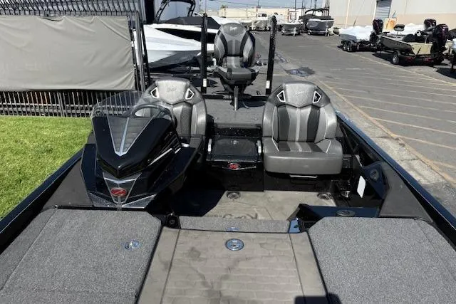 Slide: The Image of 2025 Ranger Z521R Cup-Equipped boat with sleek seating and modern design in a marina setting. - 15
