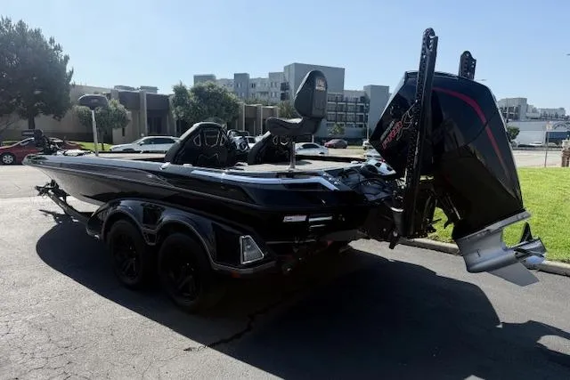 Slide: The Image of 2025 Ranger Z521R Cup-Equipped boat, sleek black design, parked outdoors. - 3