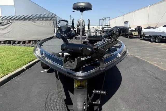 Slide: The Image of 2025 Ranger Z521R Cup-Equipped boat with advanced fishing equipment, parked outdoors. - 6
