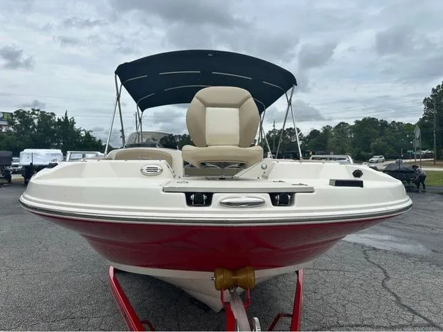 Slide: The Image of 2016 Stingray 192 SC boat with red hull and black canopy. - 10