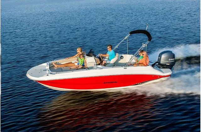 Slide: The Image of 2016 Stingray 192 SC boat cruising on water with passengers. - 11