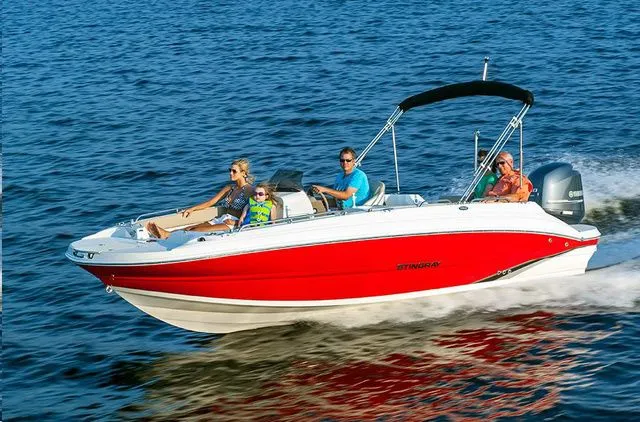 Slide: The Image of 2016 Stingray 192 SC boat on water with passengers. - 12