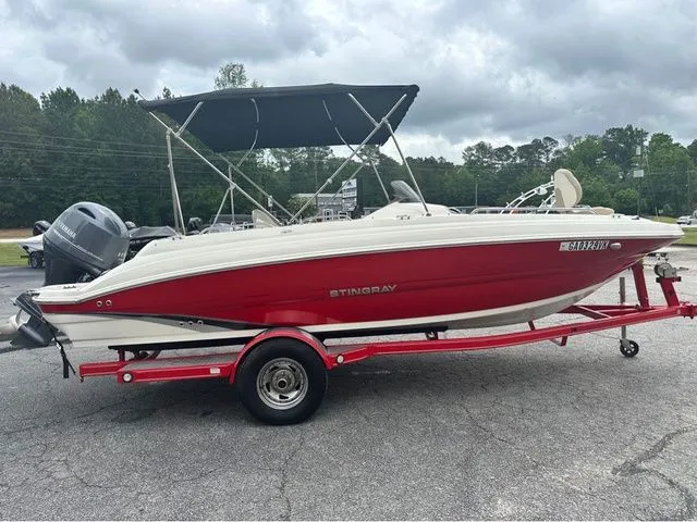 Slide: The Image of 2016 Stingray 192 SC boat on trailer, red and white. - 2