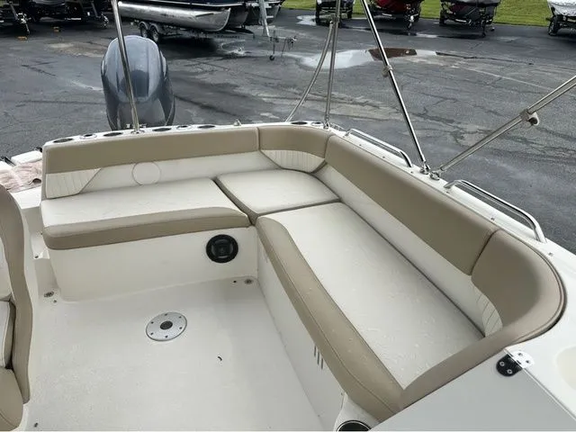 Slide: The Image of Interior of a 2016 Stingray 192 SC boat with beige seating. - 8