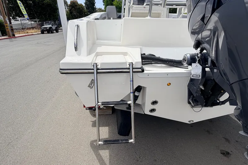 Slide: The Image of 2026 Defiance Catalina 210 boat rear view with ladder and motor on display. - 22