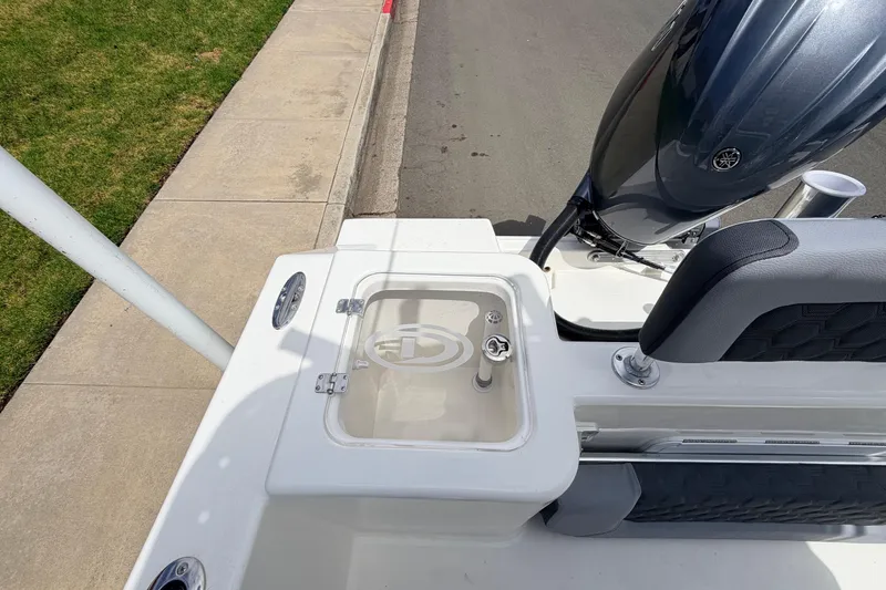 Slide: The Image of 2026 Defiance Catalina 210 boat deck with motor and seating, showcasing modern design. - 28