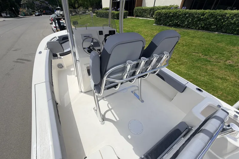 Slide: The Image of 2026 Defiance Catalina 210 boat interior with dual seats and steering console. - 29
