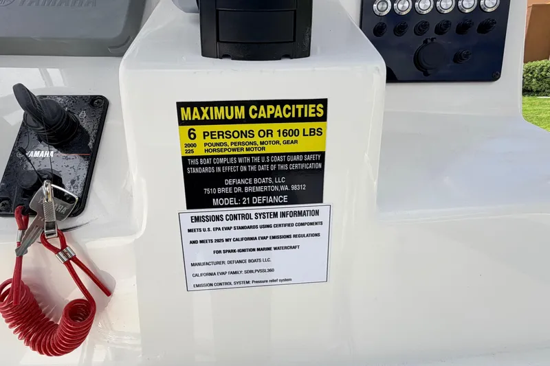 Slide: The Image of Defiance Catalina 210 boat capacity label, 6 persons or 1600 lbs, 225 horsepower motor. - 34