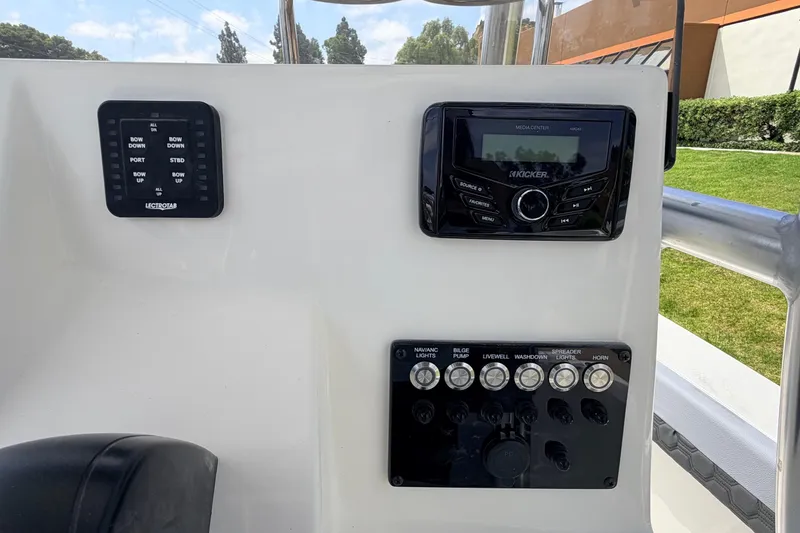 Slide: The Image of Control panel of 2026 Defiance Catalina 210 boat with navigation and audio systems. - 35