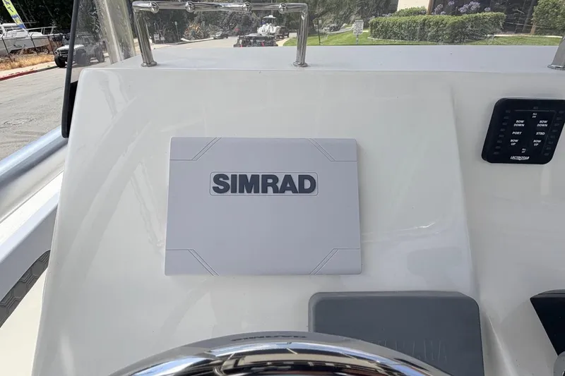 Slide: The Image of Simrad navigation system on 2026 Defiance Catalina 210 boat dashboard. - 36