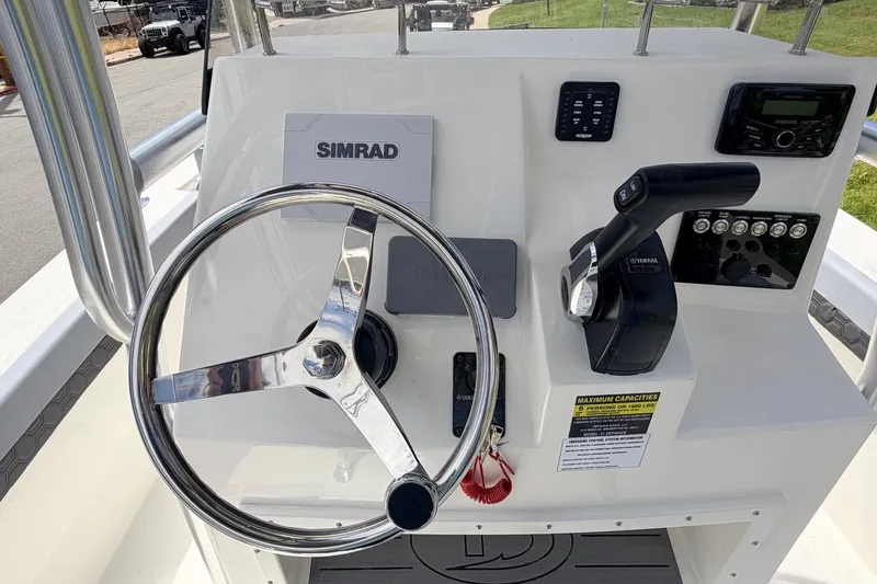 Slide: The Image of Helm of 2026 Defiance Catalina 210 boat with steering wheel and controls. - 37