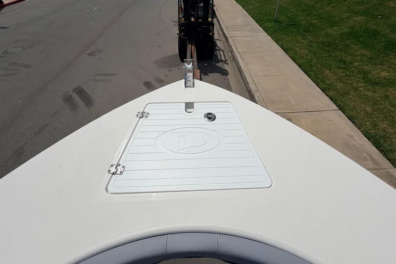 Slide: The Image of Bow view of 2026 Defiance Catalina 210 boat on a trailer, parked on a street. - 52