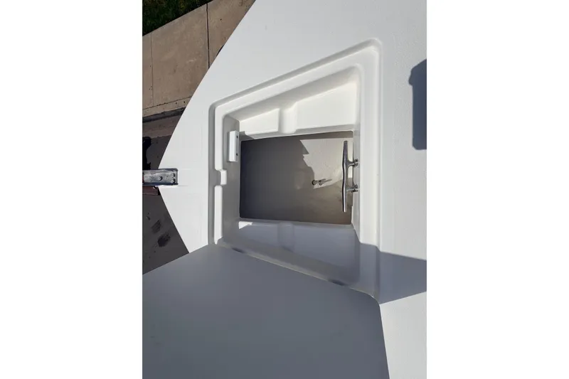Slide: The Image of Open storage compartment on 2026 Defiance Catalina 210 boat deck. - 53