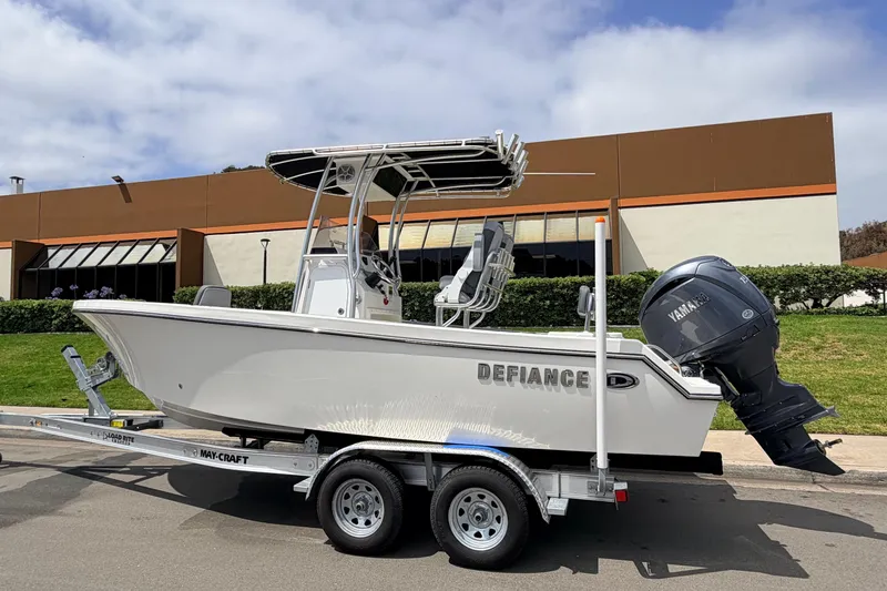 Slide: The Image of 2026 Defiance Catalina 210 boat on trailer, parked outdoors with Yamaha engine. - 7