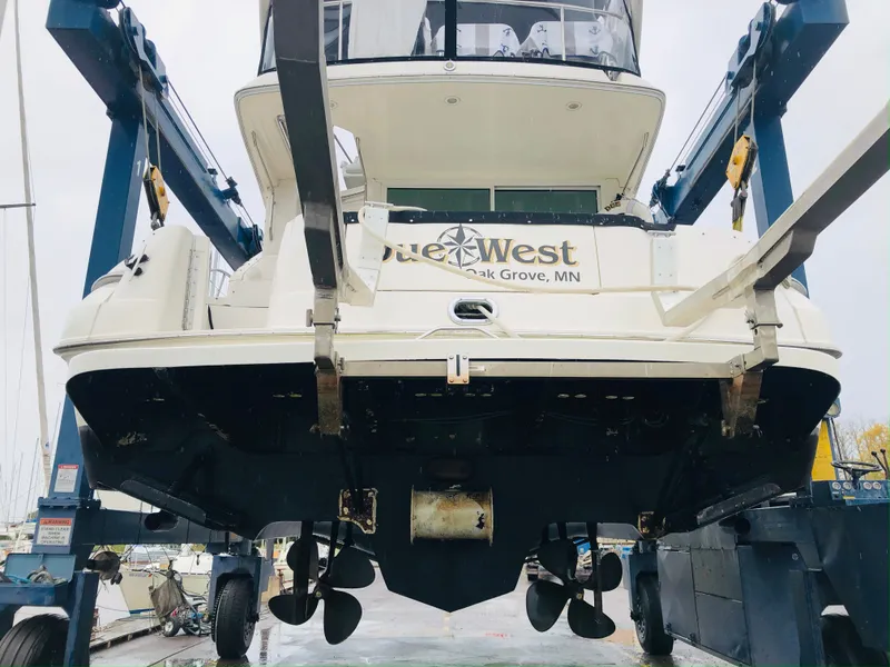 Slide: The Image of 1996 Sea Ray 400 Sedan Bridge on boat lift, rear view. - 2
