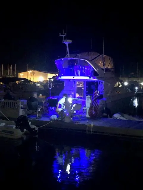 Slide: The Image of 1996 Sea Ray 400 Sedan Bridge at night in harbor. - 3