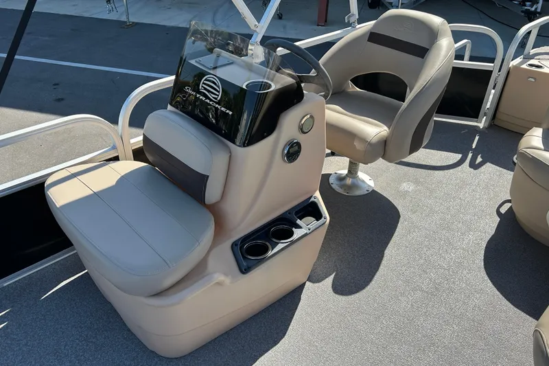 Slide: The Image of 2017 Sun Tracker Bass Buggy 18 DLX boat interior with steering console and seating. - 10