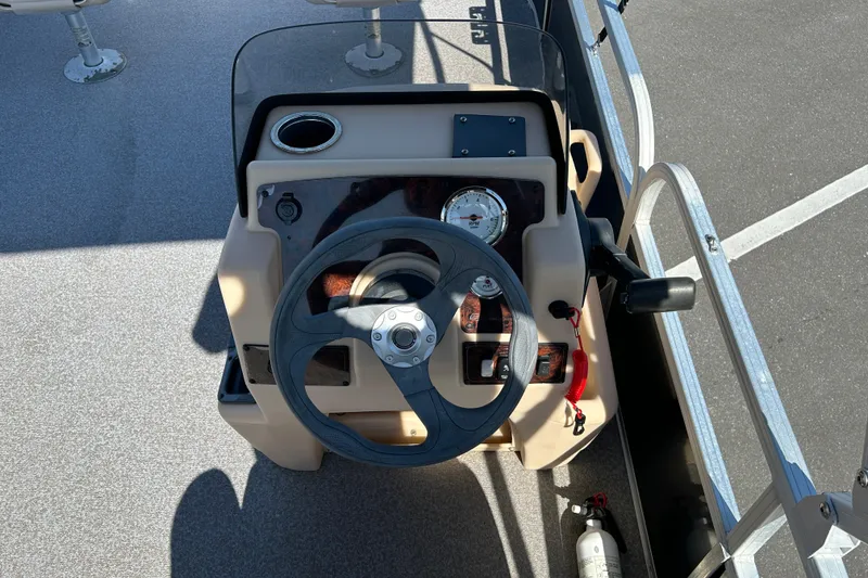 Slide: The Image of Steering console of a 2017 Sun Tracker Bass Buggy 18 DLX pontoon boat. - 12